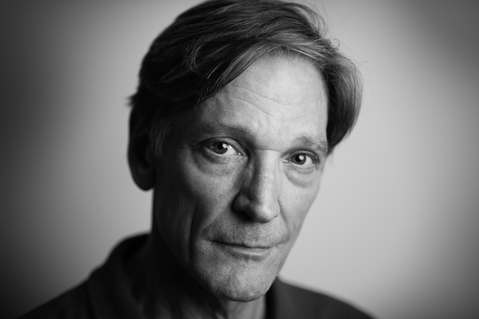 Black and white close-up actor headshot of a man with an intense, direct gaze against a neutral studio background — professional headshots in Spokane, WA by Scott Martinez